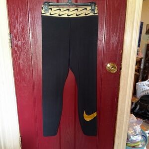 Nike Women’s Black Leggings with Gold Swoosh and Patterned Waistband